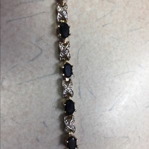 Gold bracelet with diamonds and black onyx 7.25”